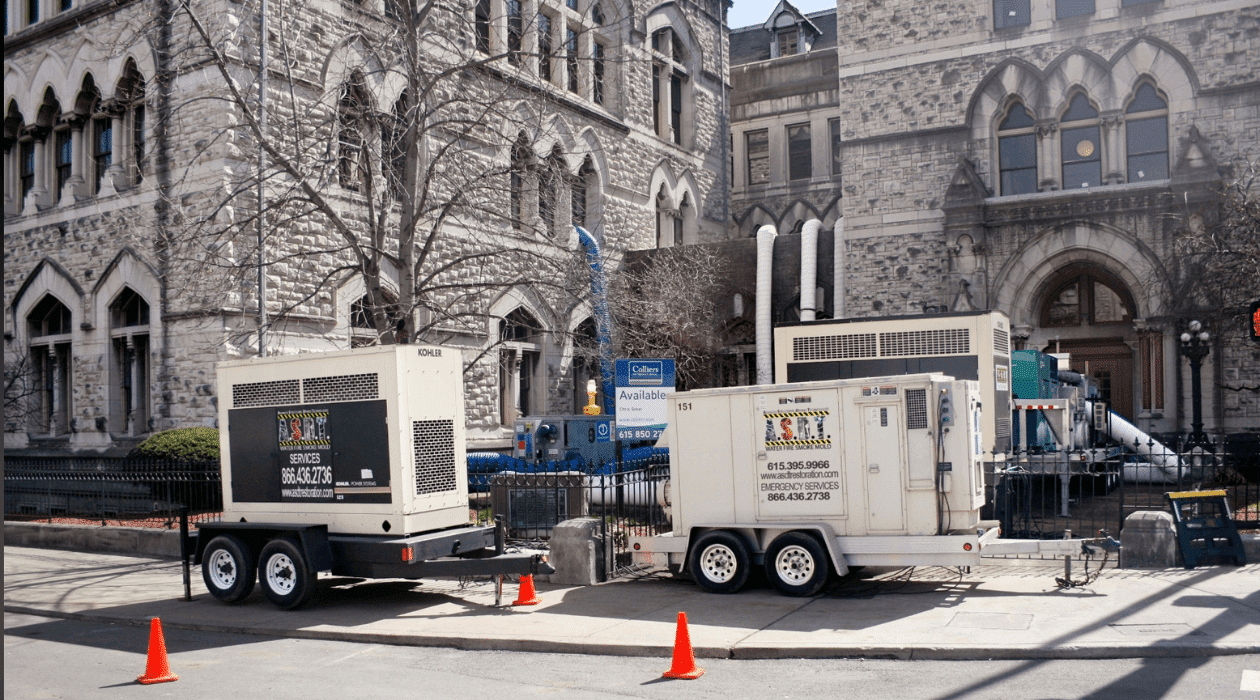 a truck on a city street in front of a building