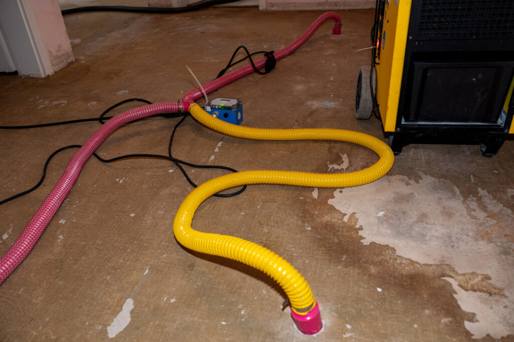 Structural drying equipment operating inside a high-rise building after water damage.